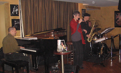 Audrey singing with pianist and saxophonist at Jazz Round Shanghai
