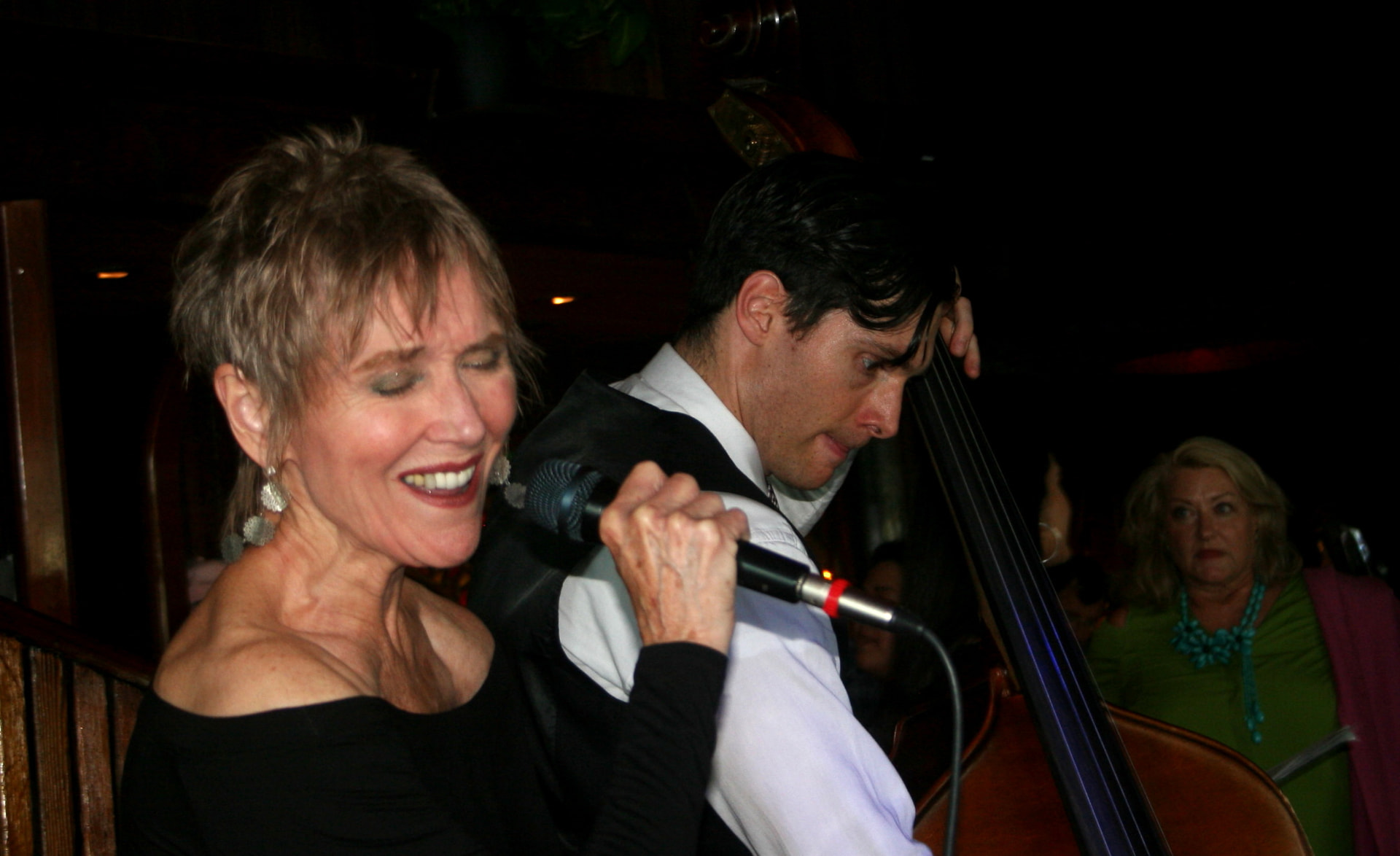 Audrey singing beside the bassist at the Trident
