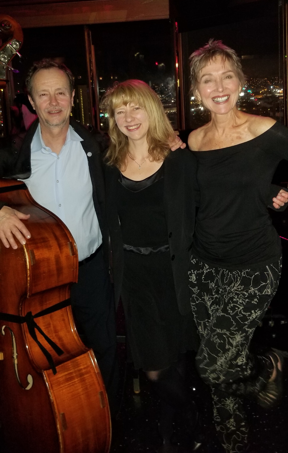 Audrey with her bassist and pianist at a night-view club