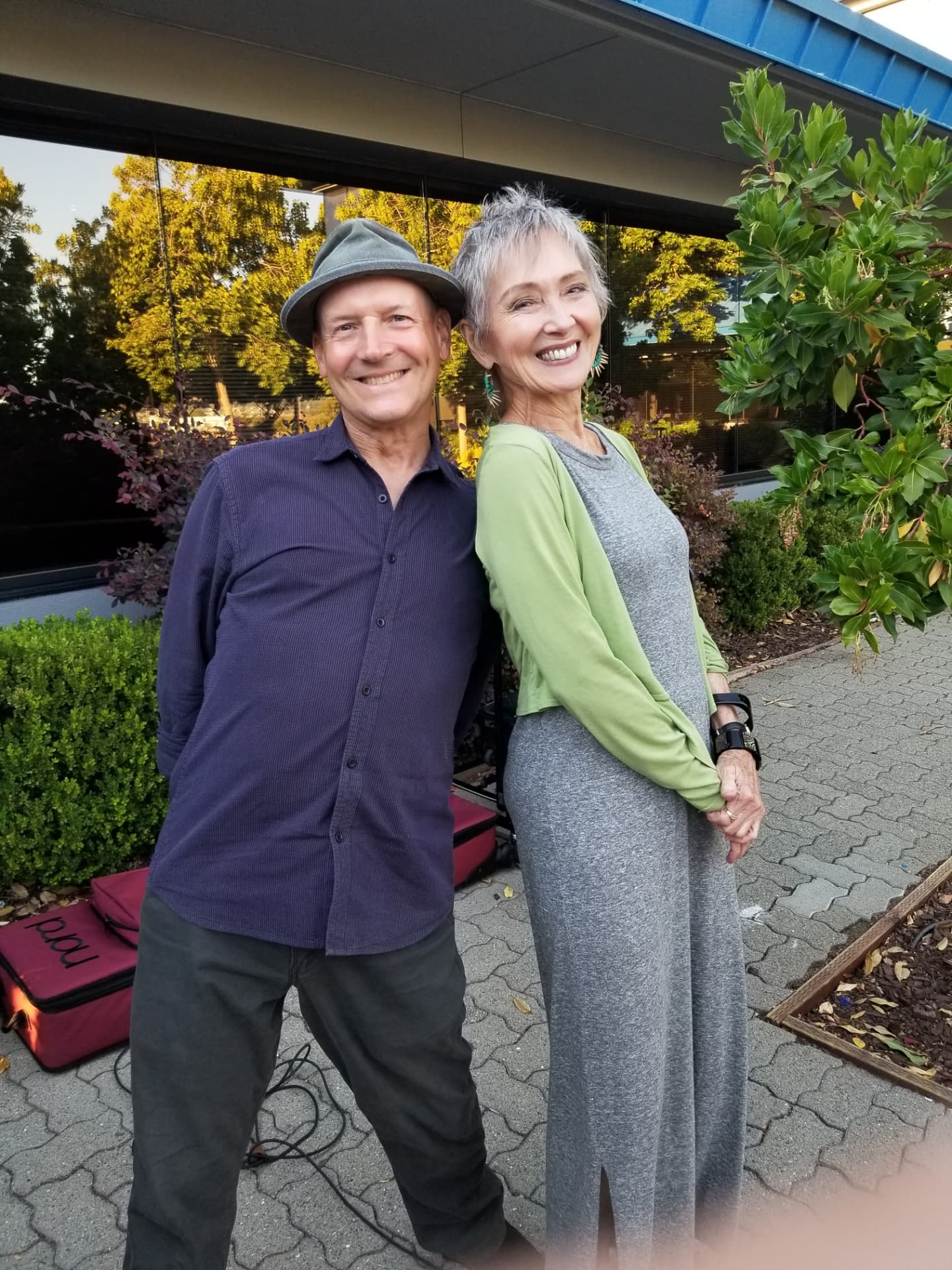 Audrey smiling with her keyboardist outside Jason's before a show