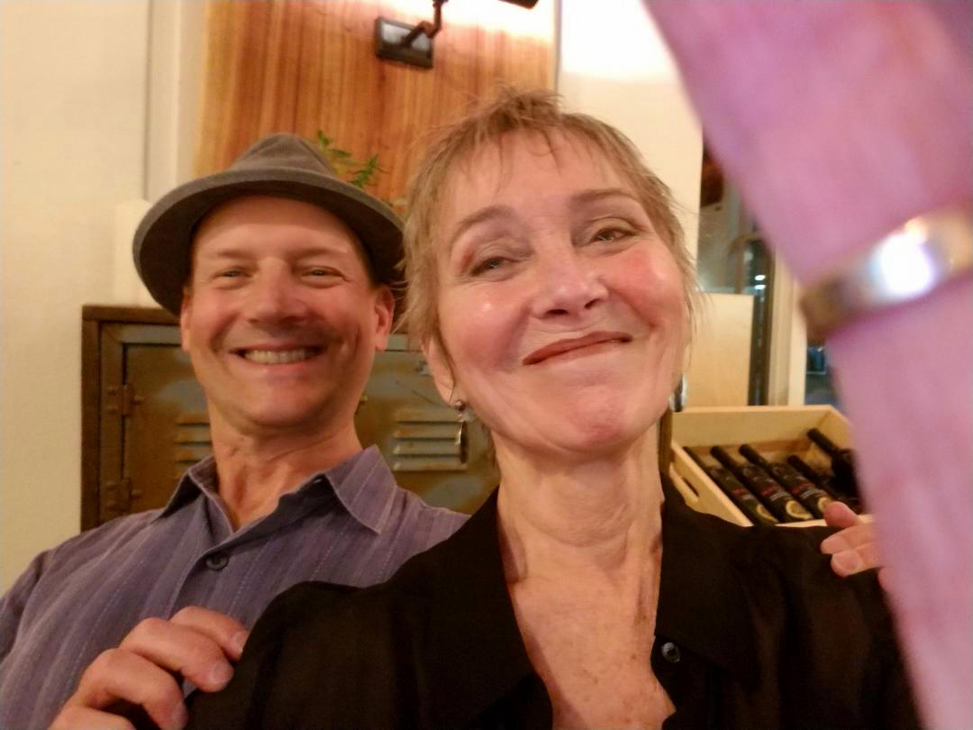 Audrey smiling with a bandmate after a show